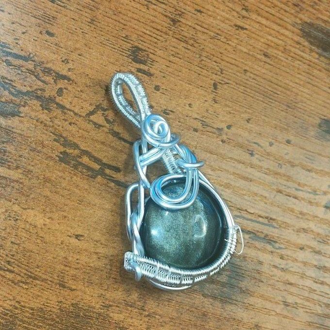 Amulette Obsidienne Dorée